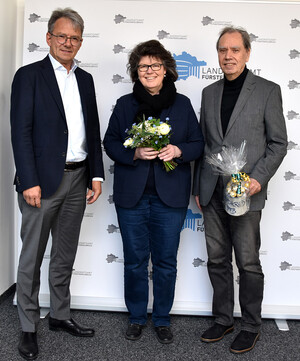 Gruppenfoto mit zwei Männern und einer Frau